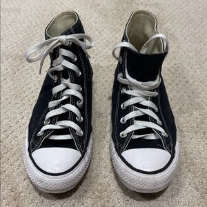 Black High-Top Sneakers with White Laces
Chuck Taylor Converse